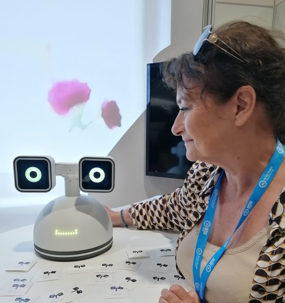 Notre ambassadrice avec le robot Haru lors du AI for Good Global Summit 2026.